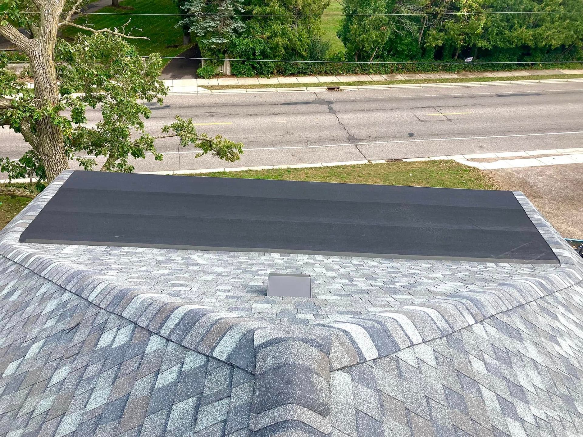 New architectural shingle roof with crisp hip and ridge detail