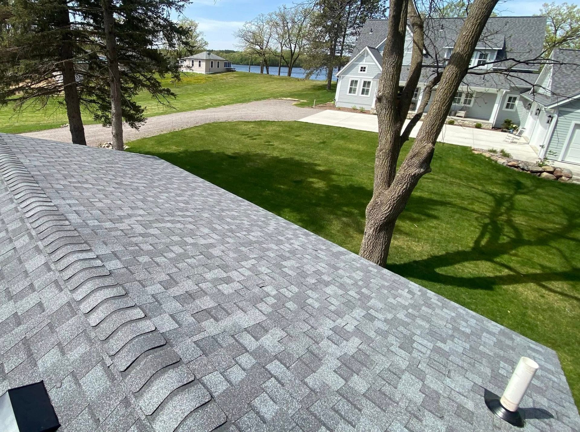 Finished custom home roof overlooking a Minnesota lake